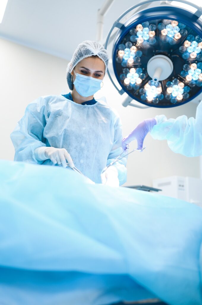Female surgeon and assistant, professional surgery